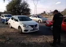 May be an image of 1 person, car and road