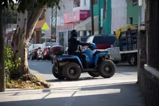 May be an image of 1 person, motorcycle and road