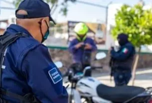 May be an image of 3 people, people standing, motorcycle and outdoors