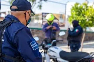 May be an image of 3 people, people standing, motorcycle and outdoors